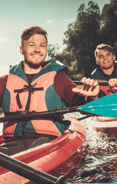 image of group of people kayaking 