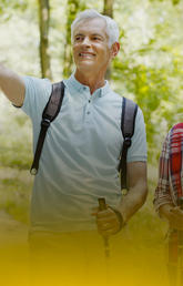 image of two seniors hiking and pointing at something