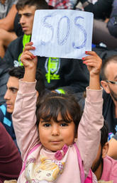 girl holding SOS sign