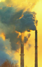 image of industrial chimneys polluting