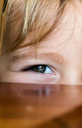 image of kid playing hide and seek