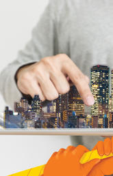 A person holding a city and pointing