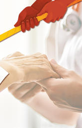 A nurse holds a patient's hand