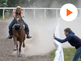 screengrab showing a horse and its rider running and a person measuring speed