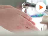 image of someone washing their hand