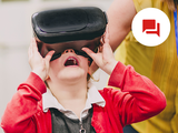 photo of kid using a vr