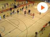 picture of a basketball court and kids playing in it