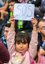 image of child holding and SOS sign